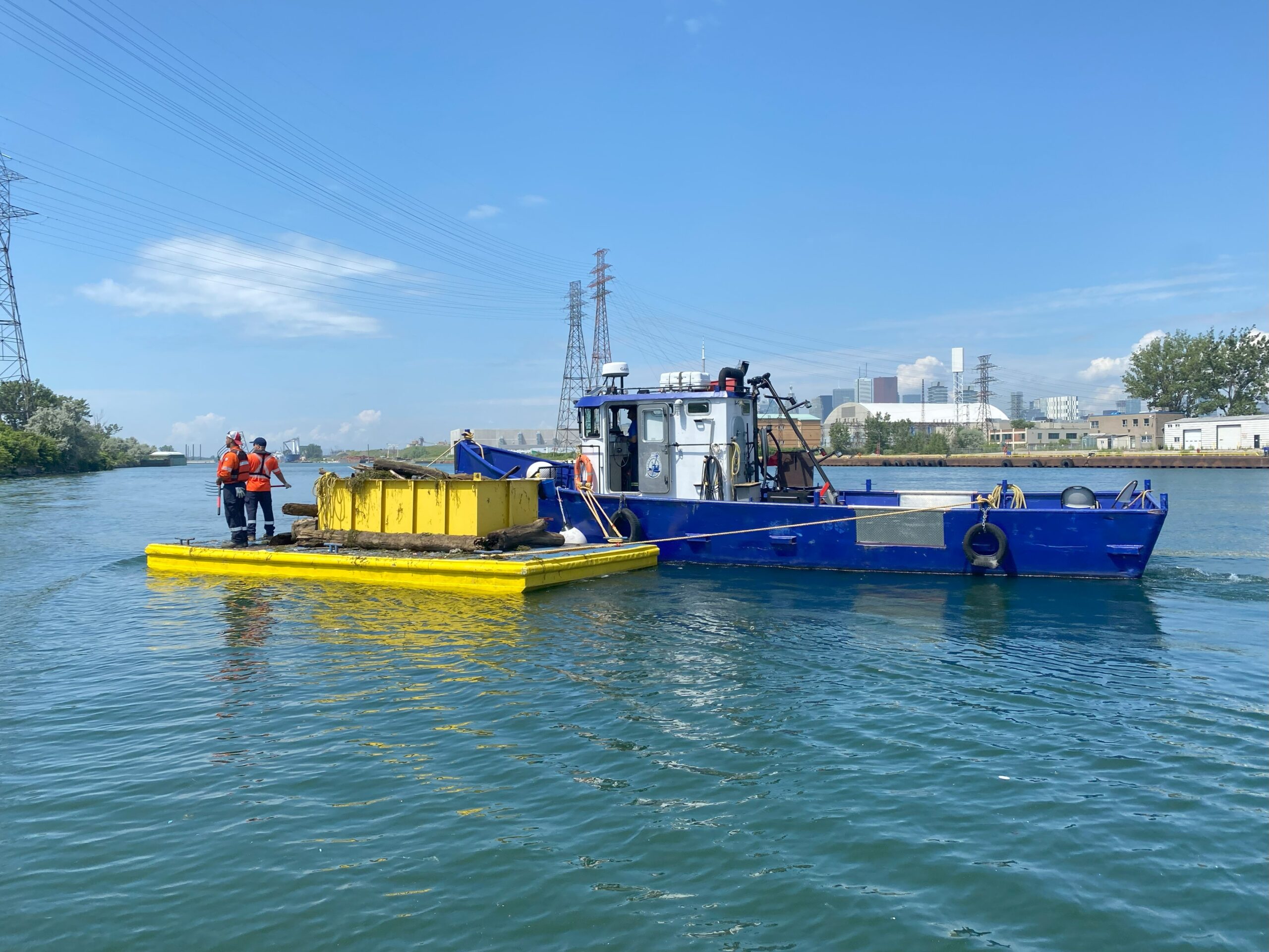 The harbour clean-up crew at work on the water.